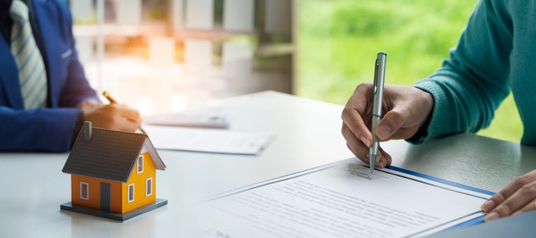 “first home buyer signing mortgage documents”