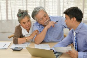 Senior couple getting smsf home loan advice from a broker