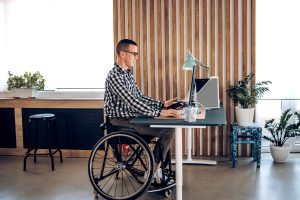 A disabled man enjoying his NDIS house